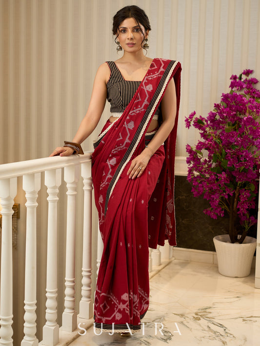 Exquisite Jamdani saree in regal red with intricate motifs and lace borders