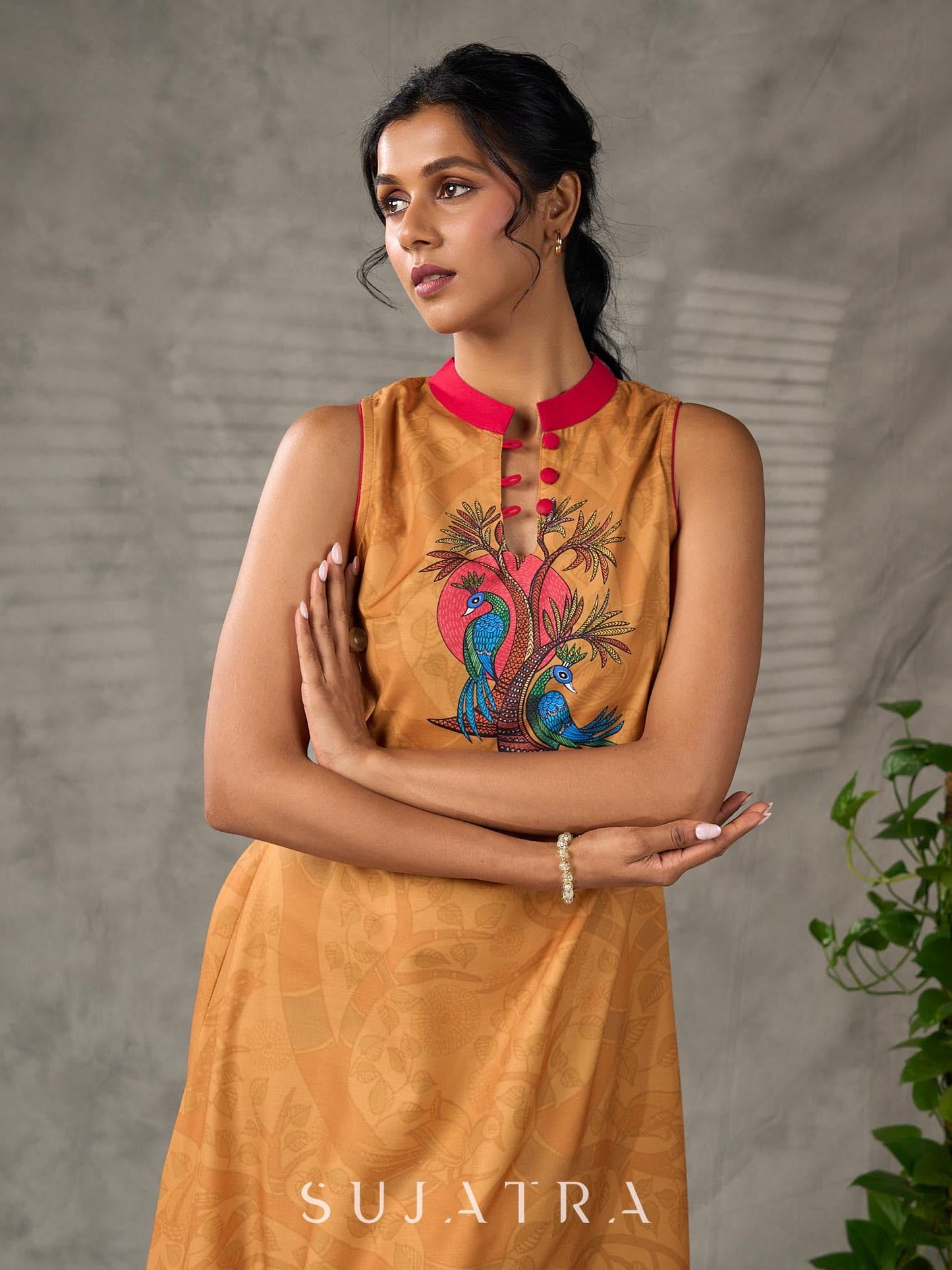 Mustard Gond printed mandarin collar dress with vibrant pink accents.