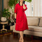 Elegant red dress featuring delicate, hand-painted Madhubani lotus motif detailing.