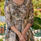 Elegant black–white floral kurta featuring a graceful bias silhouette, intricate mirror embroidery on the neck and sleeves, and a sweetheart neckline.