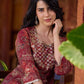 Exquisite deep maroon printed kurta with a graceful bias silhouette, intricate handwork on the yoke, and scalloped sleeve detailing.