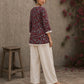 Deep red Jaipur floral printed top featuring maroon pintuck yoke, off-white panel, and scalloped lace detailing.