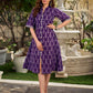 Elegant purple mercerised Ikat dress designed with a softly folded round neckline revealing grey highlights and balanced grey accents throughout