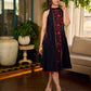 Black bias-cut block print halter dress with a red jaal hand block printed front panel, golden print detailing, and red accents for a striking, elegant statement look.