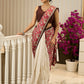Ivory elegance meets rich pink florals in this exclusive cotton saree