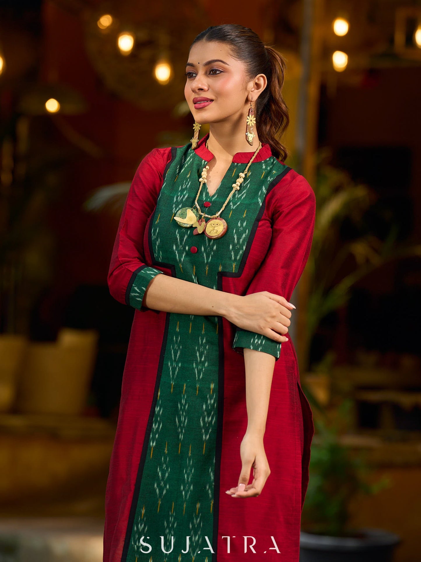 Elegant maroon cotton-silk kurta featuring a green Ikat patch and stand collar.