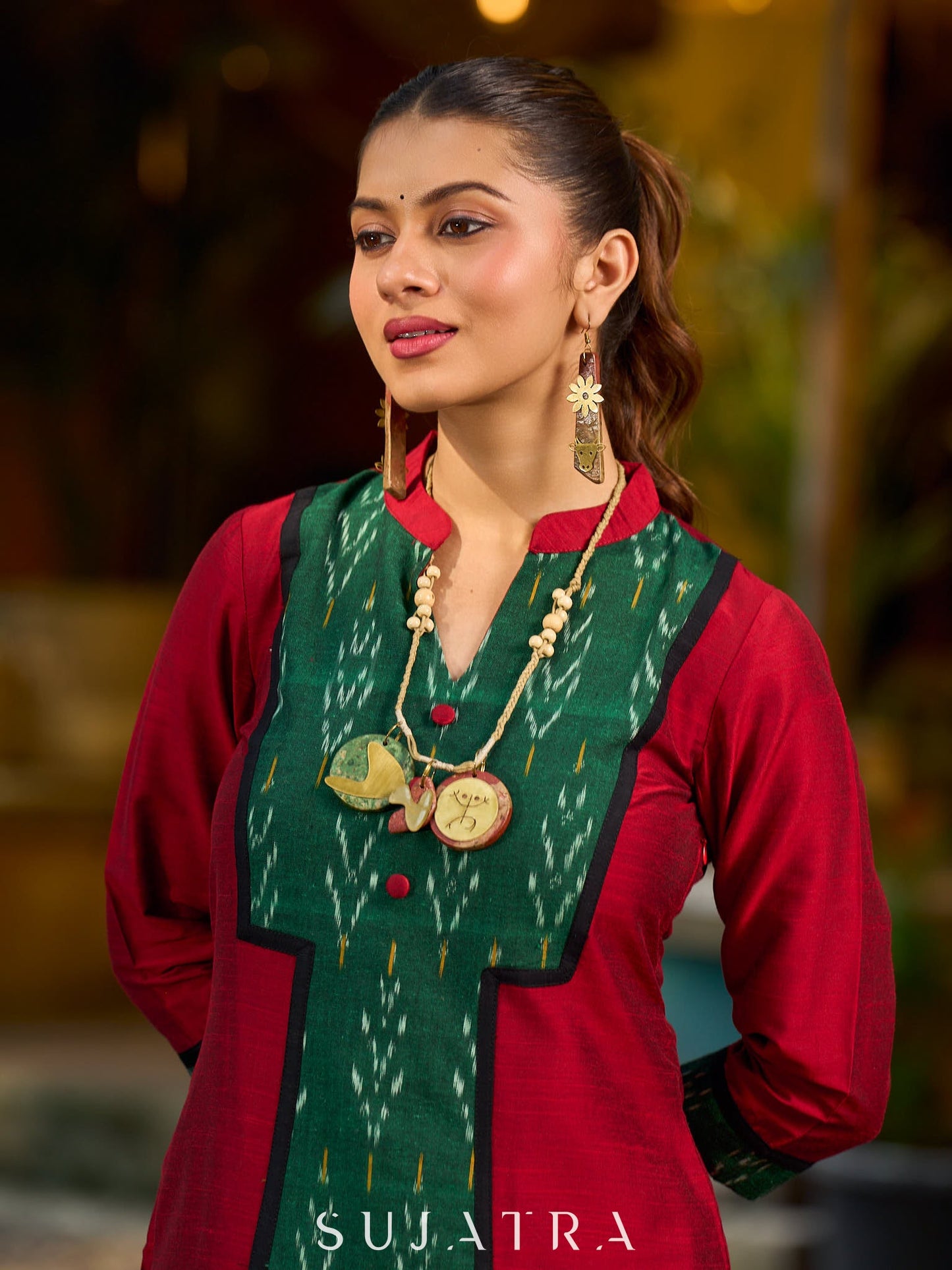 Elegant maroon cotton-silk kurta featuring a green Ikat patch and stand collar.