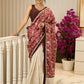 Ivory elegance meets rich pink florals in this exclusive cotton saree