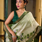 Muted Green Tussar Silk Saree with Delicate Floral Artwork and Classic Border