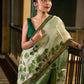 Muted Green Tussar Silk Saree with Delicate Floral Artwork and Classic Border