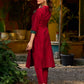 Elegant maroon cotton-silk kurta featuring a green Ikat patch and stand collar.