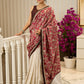 Ivory elegance meets rich pink florals in this exclusive cotton saree