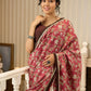 Ivory elegance meets rich pink florals in this exclusive cotton saree