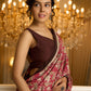 Ivory elegance meets rich pink florals in this exclusive cotton saree