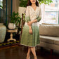 Serene ivory and sage green ombré overlap hakoba dress with olive button accents.