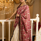 Ivory elegance meets rich pink florals in this exclusive cotton saree