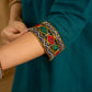Stylish dark green cotton top with pleats,mirror,and pearl work - Skirt optional