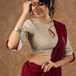A delicate beige hue blouse with asymmetrical keyhole neckline to create a stunning piece for work or leisure.