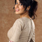 A delicate beige hue blouse with asymmetrical keyhole neckline to create a stunning piece for work or leisure.