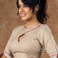 A delicate beige hue blouse with asymmetrical keyhole neckline to create a stunning piece for work or leisure.