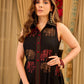 Statement black sleeveless shirt dress showcasing elephant-inspired prints and polka dots, highlighted with maroon accents.