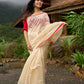 Elegant cream chanderi saree with subtle red border, featuring hand-painted Durga art