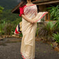 Elegant cream chanderi saree with subtle red border, featuring hand-painted Durga art
