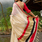Elegant cream chanderi saree with subtle red border, featuring hand-painted Durga art