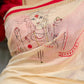 Elegant cream chanderi saree with subtle red border, featuring hand-painted Durga art