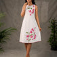 White and pink bougainvillea printed statement dress with pearl embellishments and pink accents
