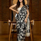 Artisanal black silk saree featuring intricate hand-drawn Kalamkari style motifs