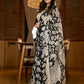 Artisanal black silk saree featuring intricate hand-drawn Kalamkari style motifs