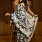 Artisanal black silk saree featuring intricate hand-drawn Kalamkari style motifs