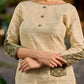 timeless cream kurta enhanced with handcrafted olive bandhani elements.