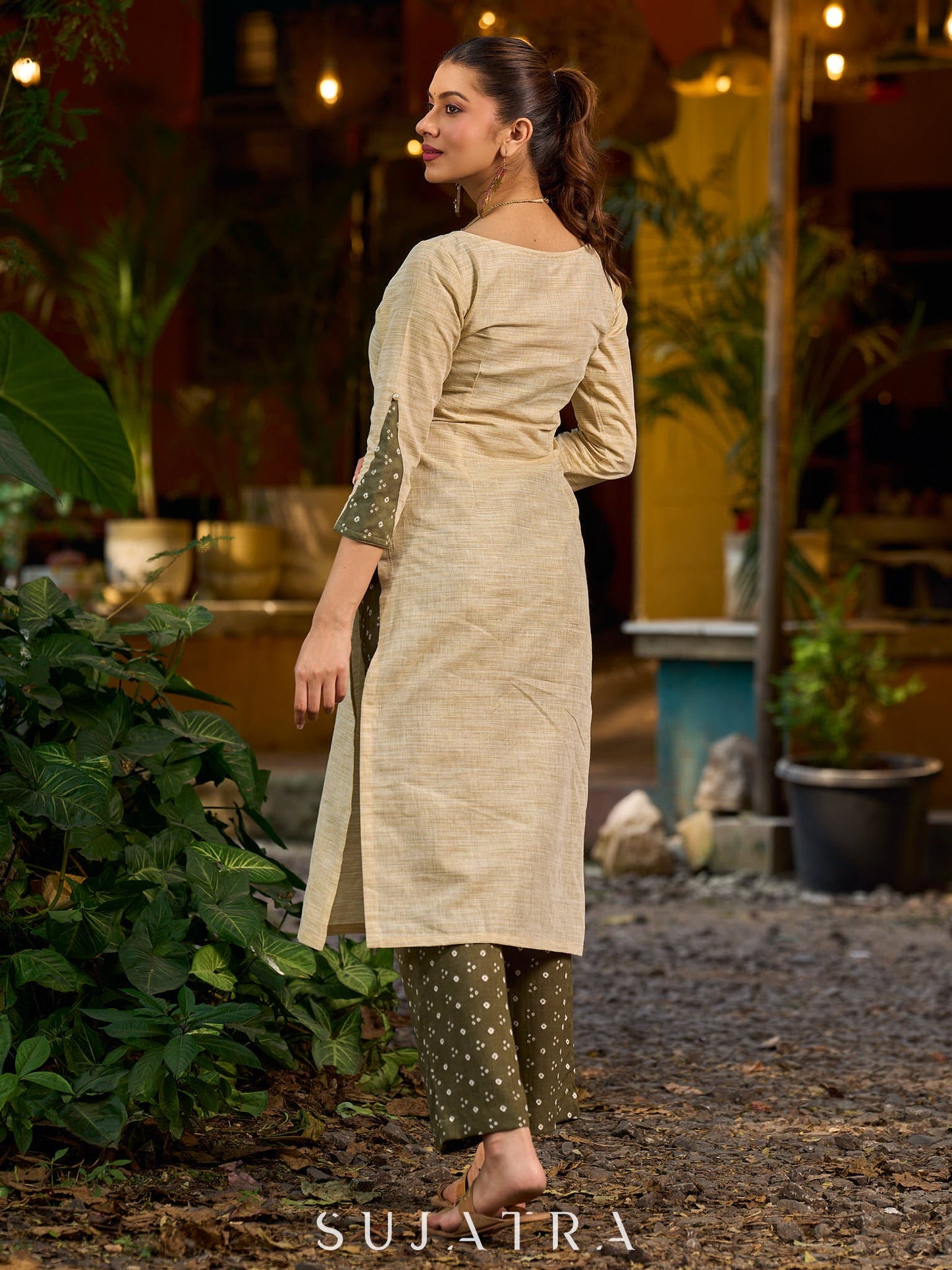 timeless cream kurta enhanced with handcrafted olive bandhani elements.