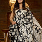 Artisanal black silk saree featuring intricate hand-drawn Kalamkari style motifs