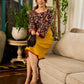 Mustard Kalamkari dress with an asymmetrical yoke and puffed sleeves.