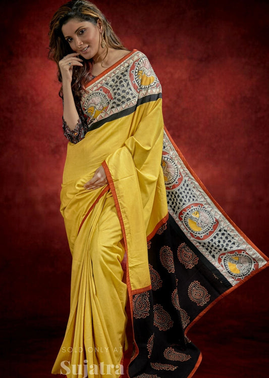 Mustard tussar staple silk saree with hand painted Madhubani border & Ajrakh pallu