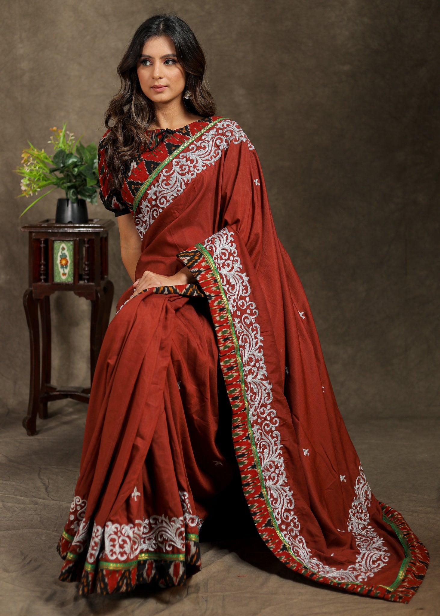 Brown Rayon saree with delicate embroidery and Ajrakh border
