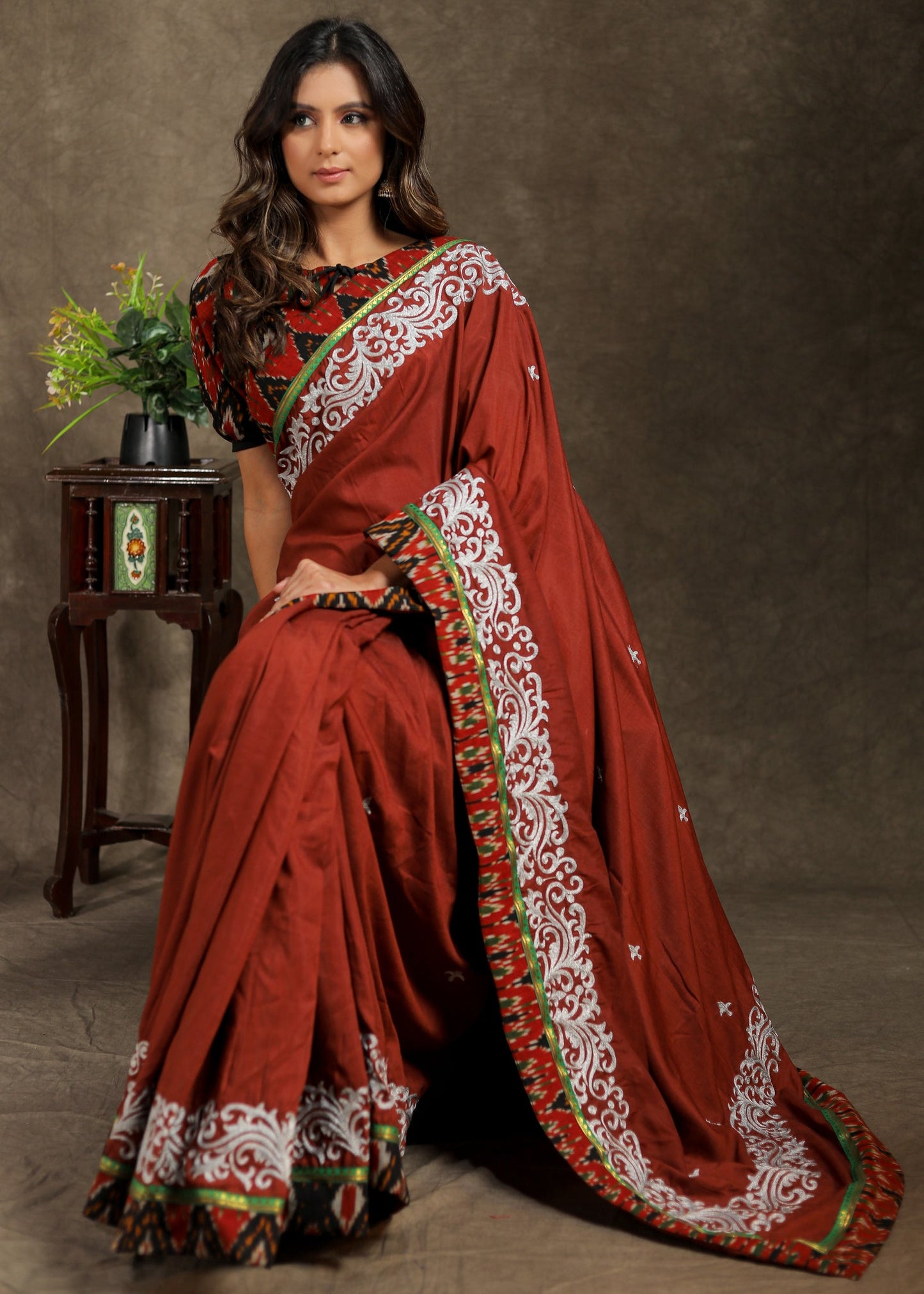 Brown Rayon saree with delicate embroidery and Ajrakh border