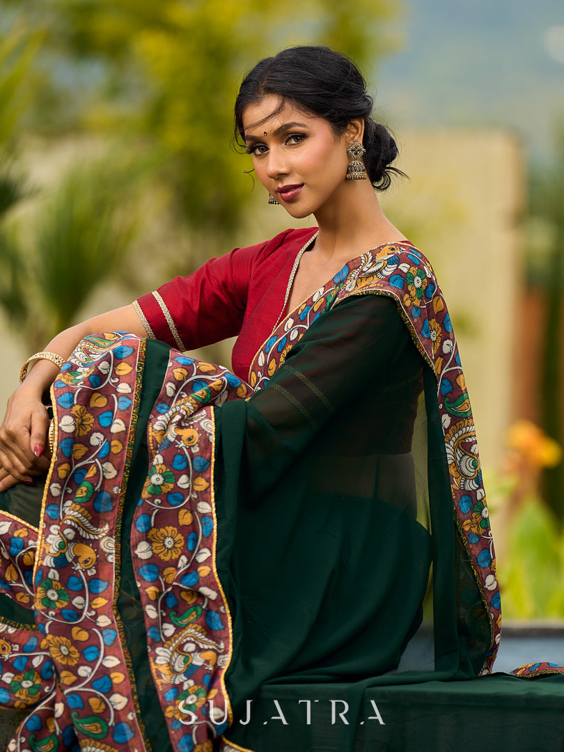 Classic Bottle Green Georgette Saree with Kalamkari Border Detailing & Ajrakh Highlight