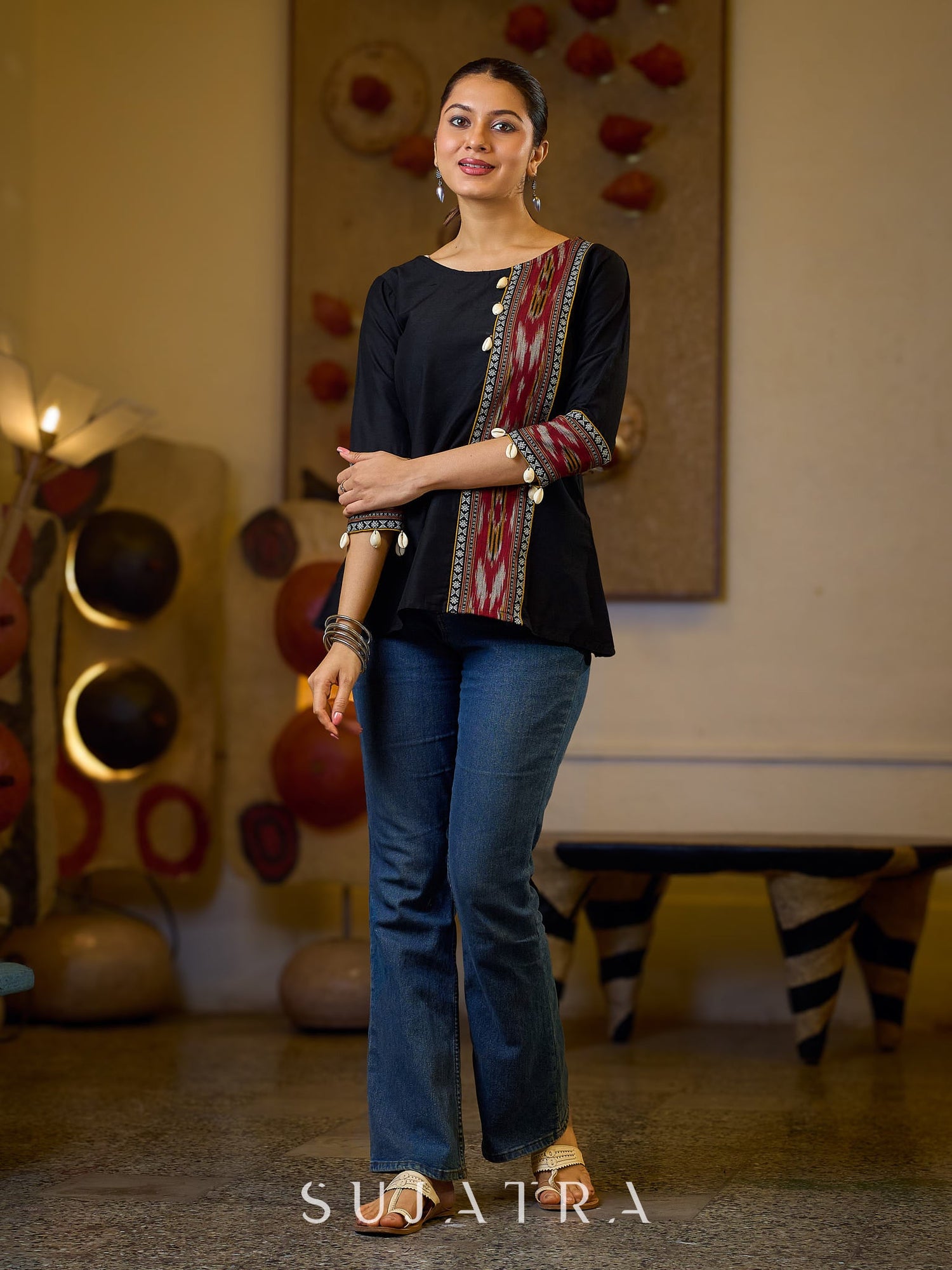Sleek Black Cotton Silk Top Adorned with Ikat Borders and Exquisite Cowrie Embellishments