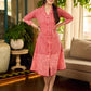 Peach and red block print stripe-floral shirt dress with fusion hand block printed stripes and jaal, a notch collar, and coordinated red accents for a vibrant, contemporary look.