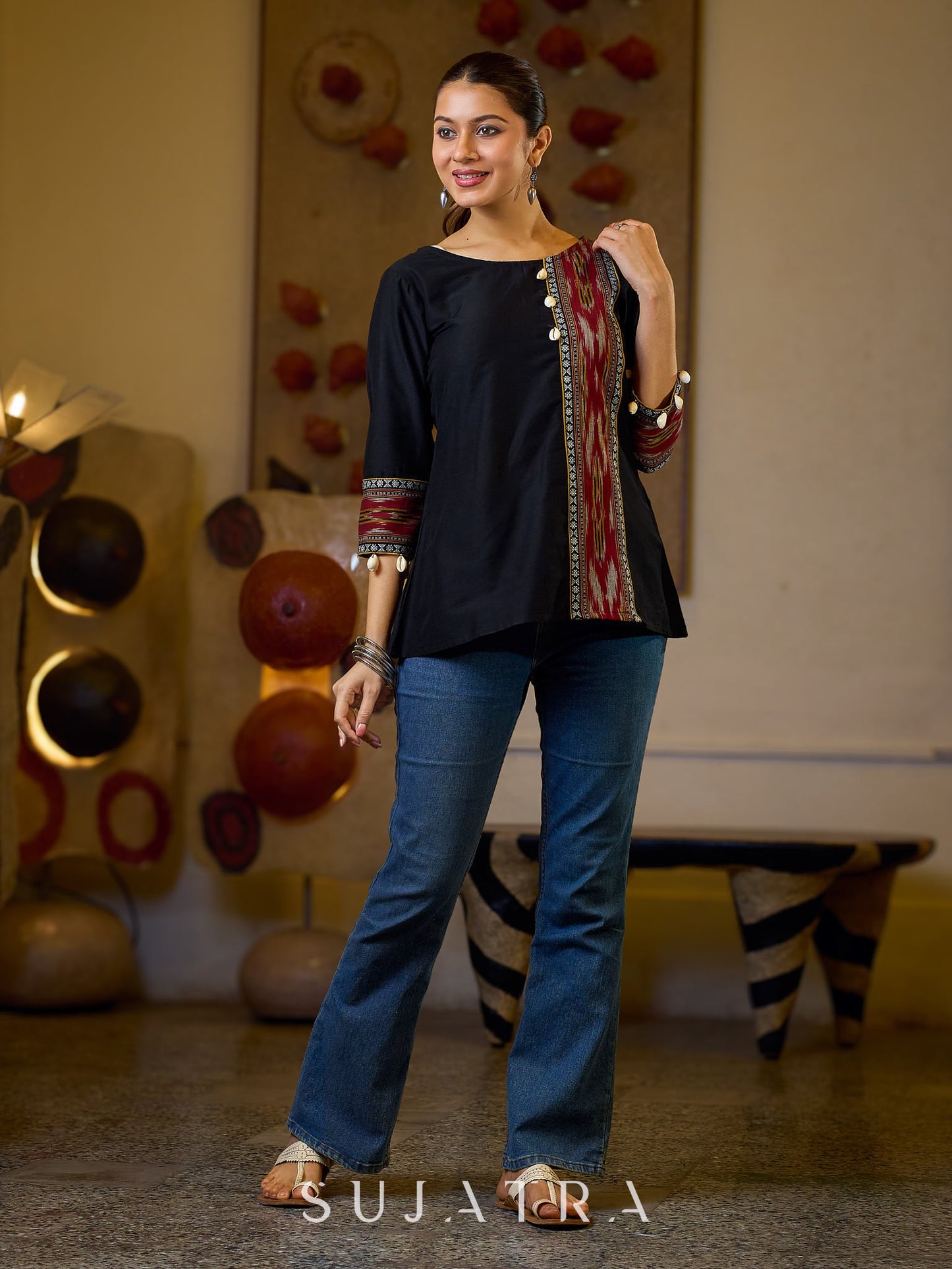 Sleek Black Cotton Silk Top Adorned with Ikat Borders and Exquisite Cowrie Embellishments