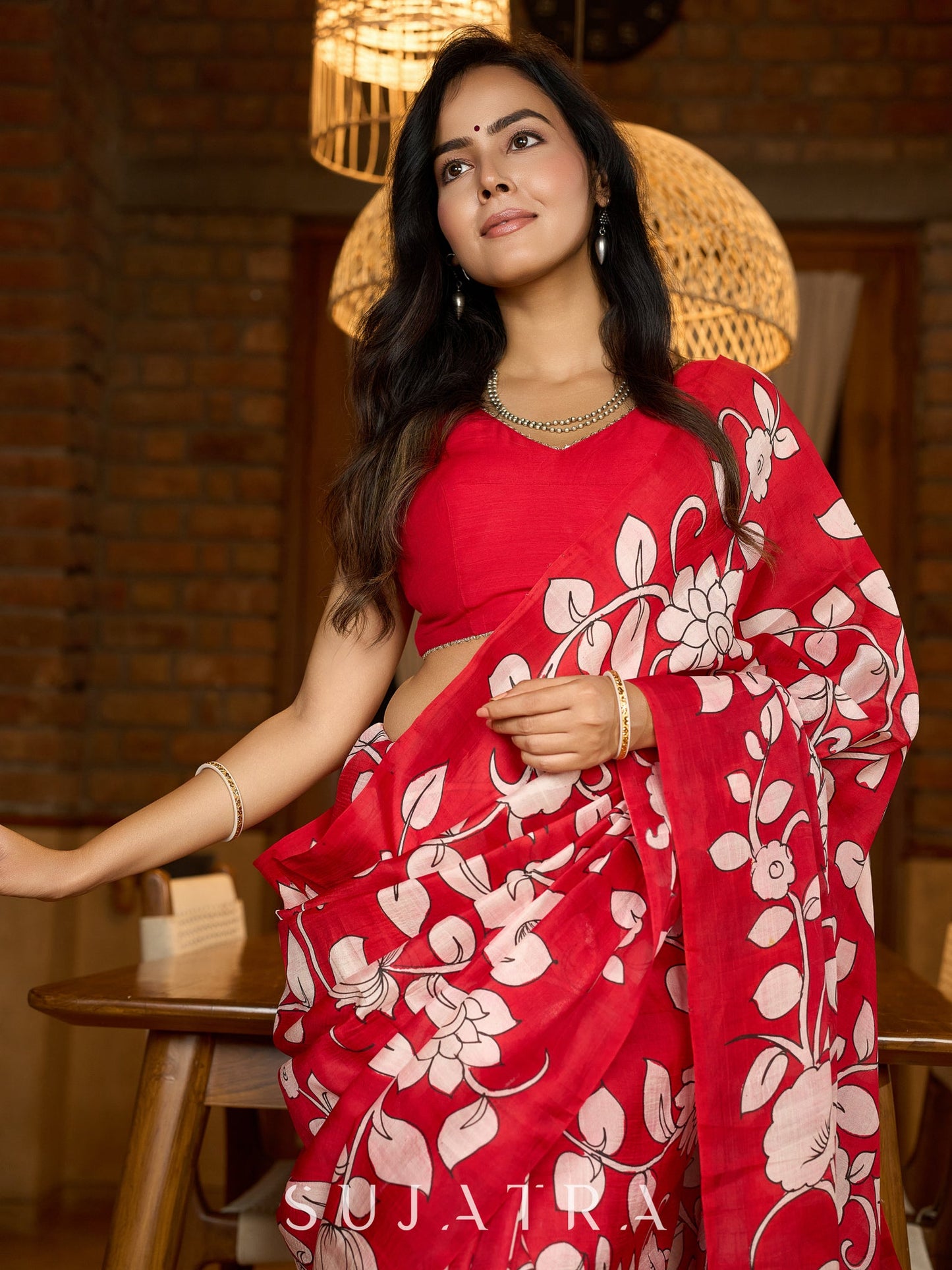 Statement red pure silk saree featuring timeless Kalamkari floral artwork