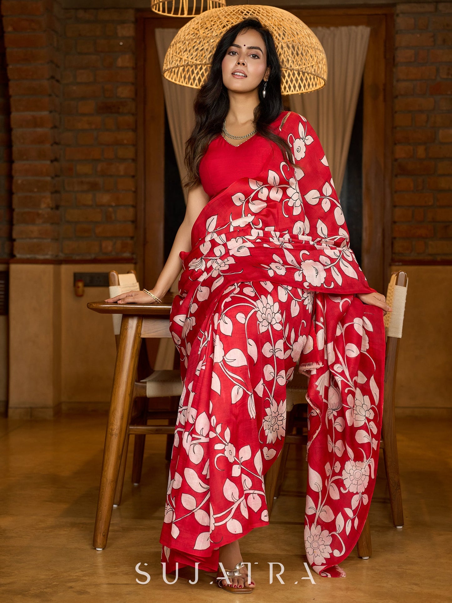 Statement red pure silk saree featuring timeless Kalamkari floral artwork