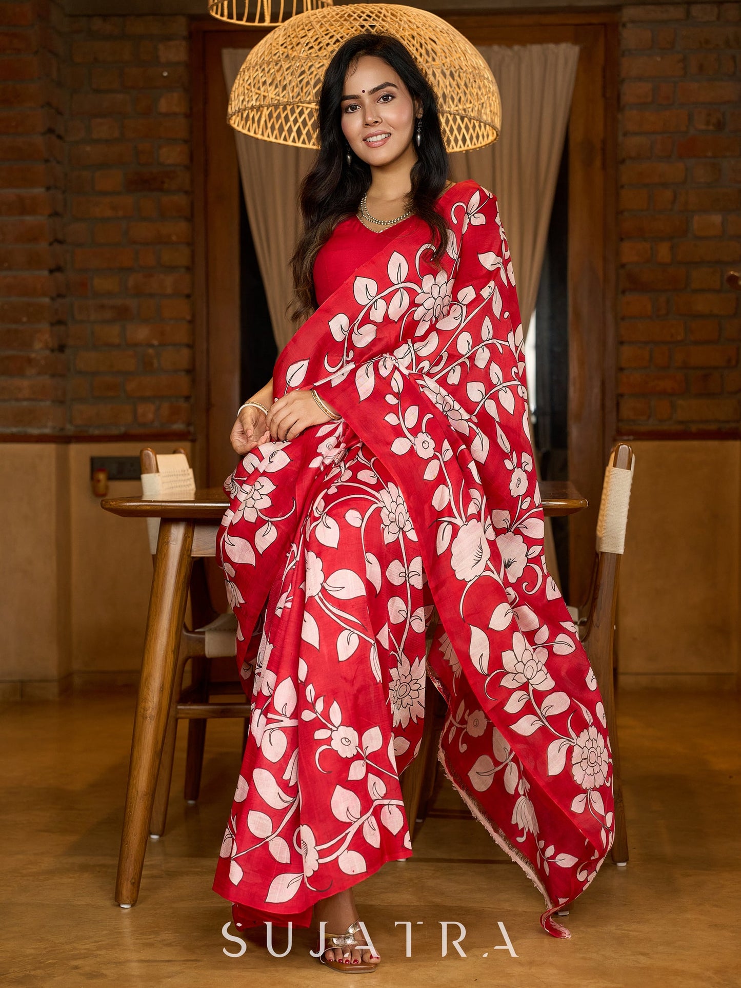 Statement red pure silk saree featuring timeless Kalamkari floral artwork