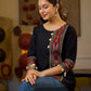 Sleek Black Cotton Silk Top Adorned with Ikat Borders and Exquisite Cowrie Embellishments