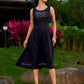Graceful Black Rayon Pleated Dress with Script Art and Painted Hemline