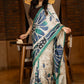 Classic ivory pure silk saree highlighted by teal borders and hand batik artistry